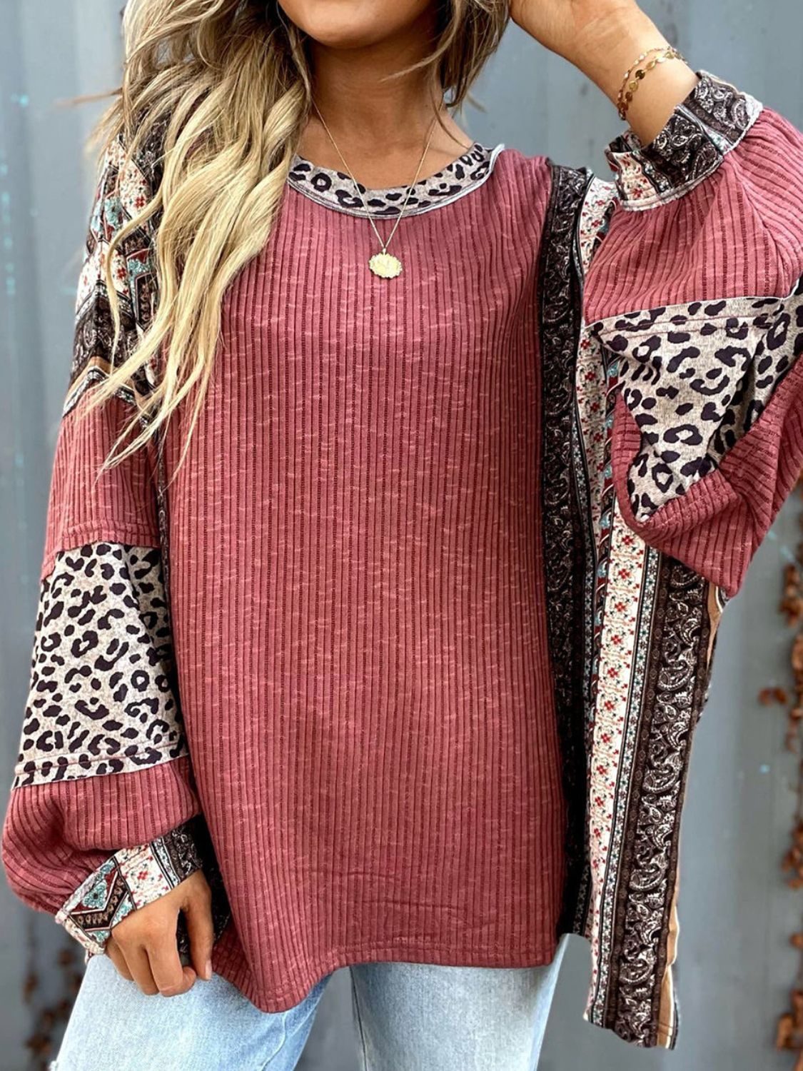 On-trend and versatile, the Leopard Round Neck Long Sleeve Sweatshirt is perfect for any occasion.