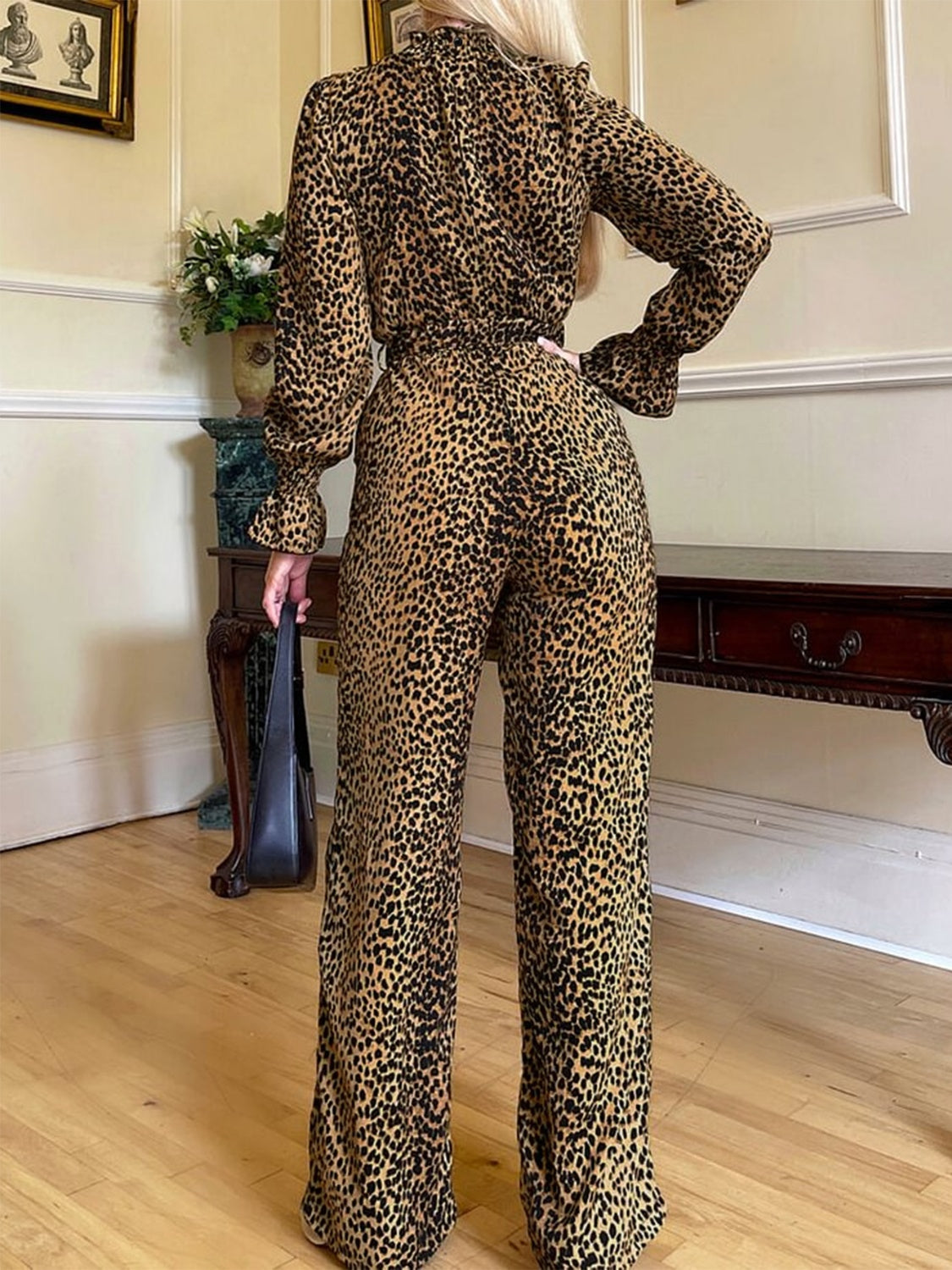 Luxury meets fashion in the Leopard Flounce Sleeve Wide Leg Jumpsuit – A must-have Jumpsuit.