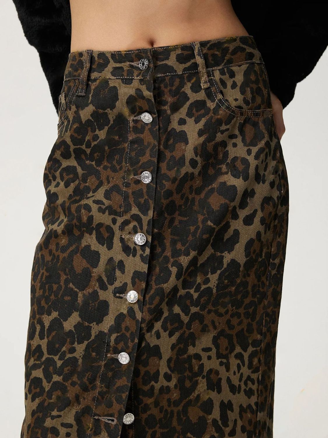 See the fine details of Leopard Button Up Denim Skirt – A stunning Bottoms choice.