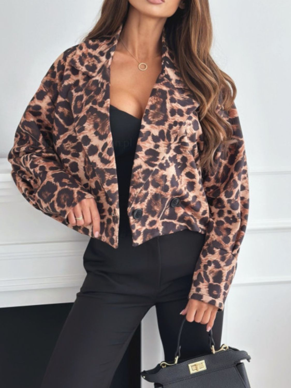 On-trend and versatile, the Leopard Collared Neck Cropped Jacket is perfect for any occasion.