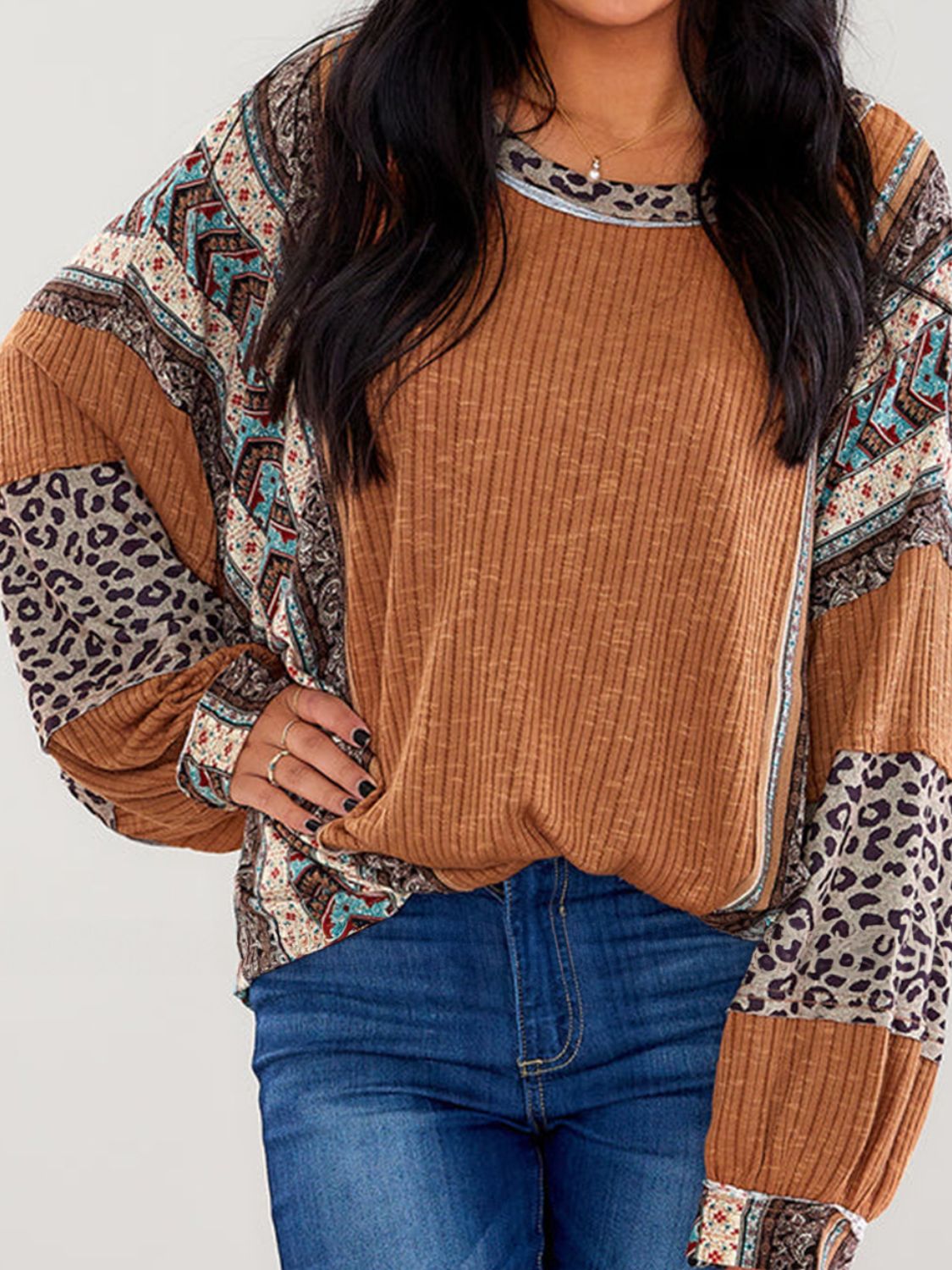 On-trend and versatile, the Leopard Round Neck Long Sleeve Sweatshirt is perfect for any occasion.